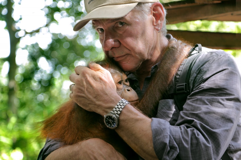 Harrison Ford, active in Conservation International for fifteen years, is currently Vice Chairman of the group which has financed the second trip to the "Lost City." Here he consoles a baby orangutan at a sanctuary in Borneo.