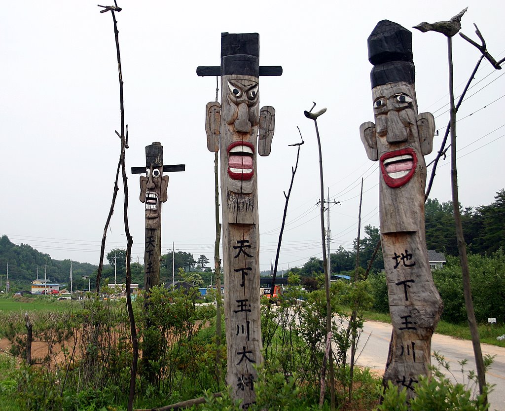 Totem poles mark the boundaries of the small community in "Night Poaching."