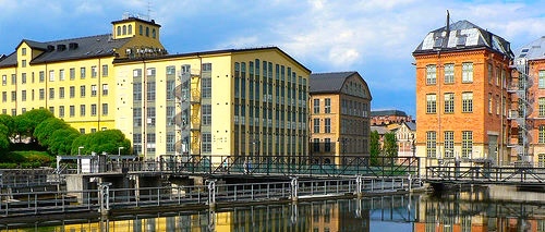 The speaker enjoys walking around, beside, and over the river on Norrkoping's waterfront.