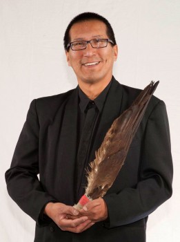 Ojibwe author Richard Wagamese, holding the symbolic eagle feathers