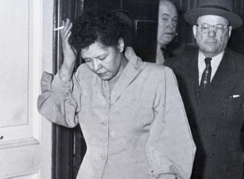Billie leaving the police station after her arrest in 1956.