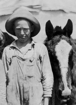 Young boy and his mule, dressed as Winona would have dressed on a trip to the city.