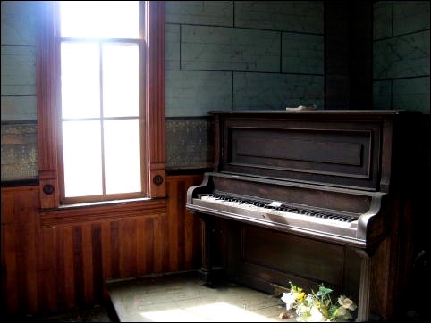 Old church piano, where Aloma practices and discovers new feelings.