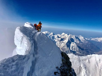 Climbing Mount Everest.