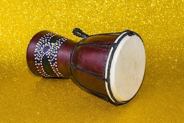 A darbuka, used at the performance by bellydancers, is played by a seated performer.