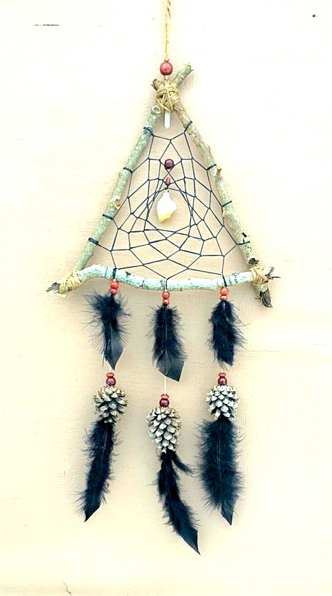 Laura loves spending time with Adam, making a dream-catcher from feathers and small pinecones.