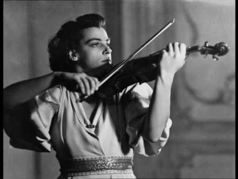 Ginette Neveu, with her Stradivarius. Click for video performance by Neveu.