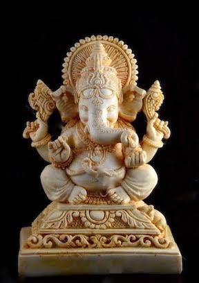 Hindu God Ganesha. Ganesha Idol on brown background