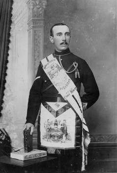 Rechabite man in his sash and elaborate dress, a vastly different appearance from what the local men are wearing.
