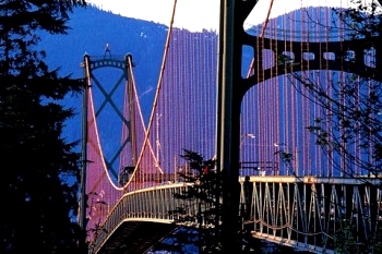 The group crosses into Vancouver via theLion's Gate Suspension Bridge on their way to an art show featuring some of Frank's photographs.