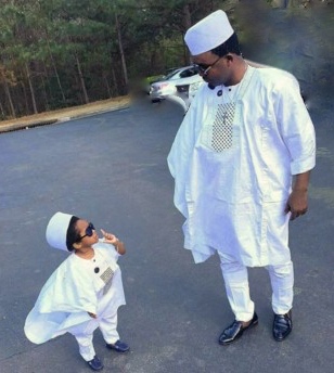 For formal occasions, the men usually wear the agbada, with its layer sleeves and long lines, as seen with this father and son.