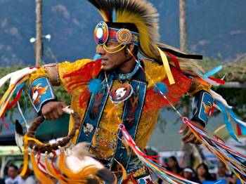 Native dancer, at Powwow, the way Orvil Red Feather imagines himself.