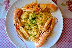 Like most books by Italian authors, the food eaten by the characters gets a great deal of attention. Here is the Risotto Agli Scampi, which Buratti ate with his friends. 